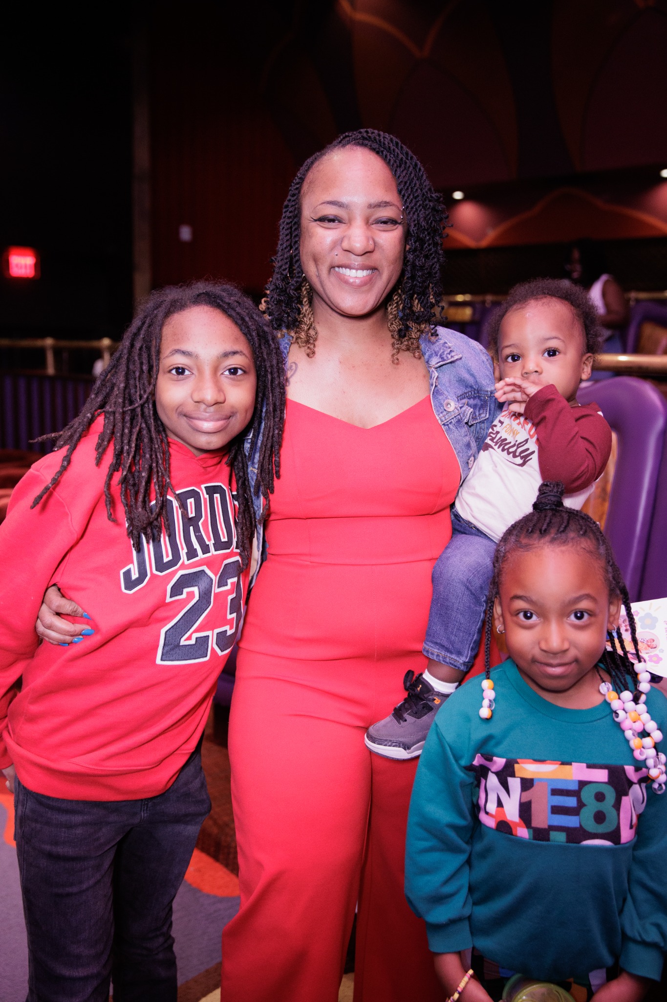 Smiling mother with her children at a Project Milk Mission community event