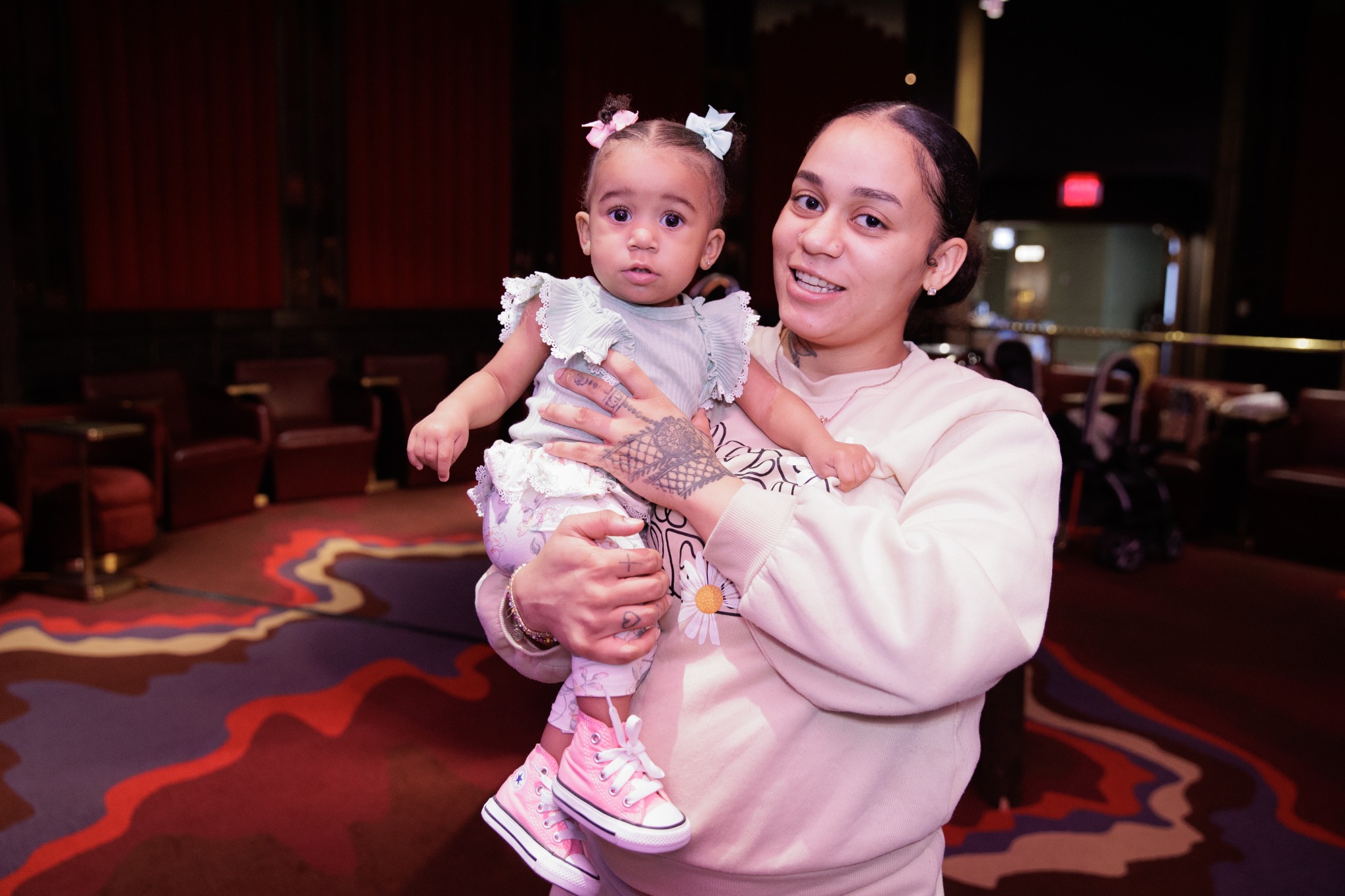 Mother holding her baby at a Project Milk Mission community event